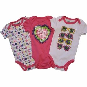 Three Hurley short sleeved onesies/bodysuits